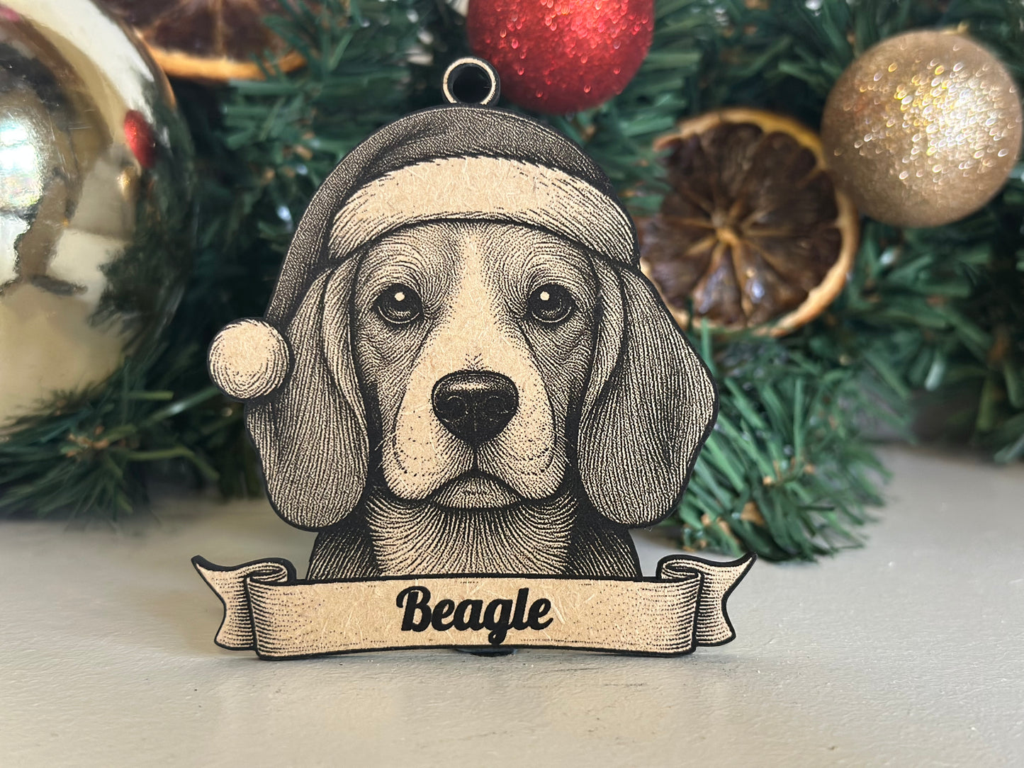 Beagle ornament with a Santa hat in front of Christmas decorations