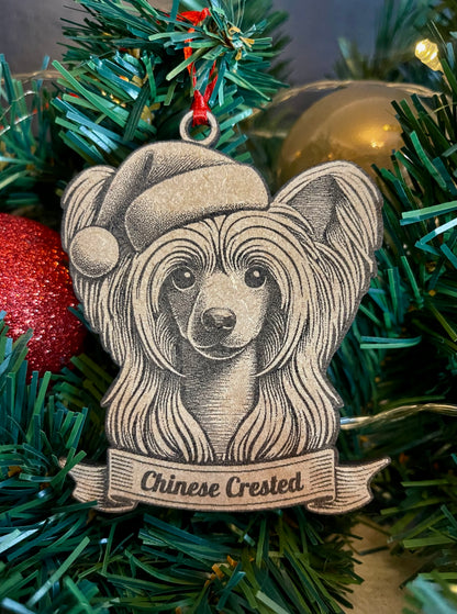 A wooden ornament in the shape of a Chinese Crested dog wearing a Santa hat, hanging on a Christmas tree.