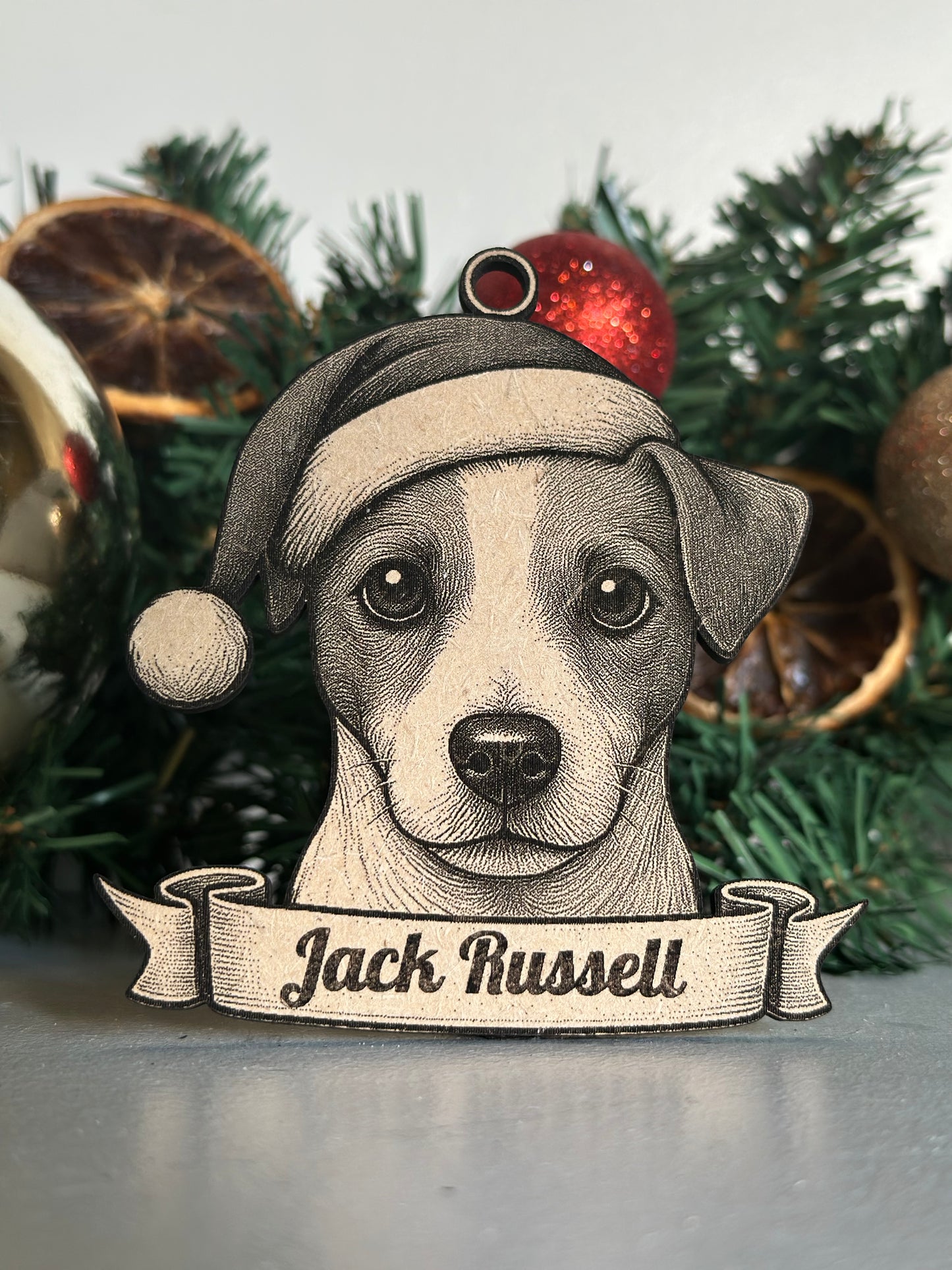 Christmas ornament with a dog design and 'Jack Russell' text on a tree.