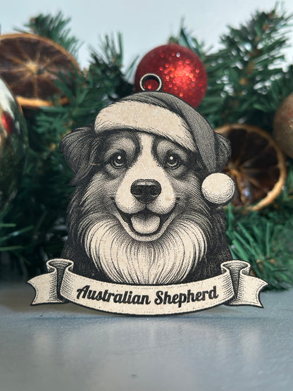 Decorative Christmas ornament with an Australian Shepherd dog wearing a Santa hat on a wreath.