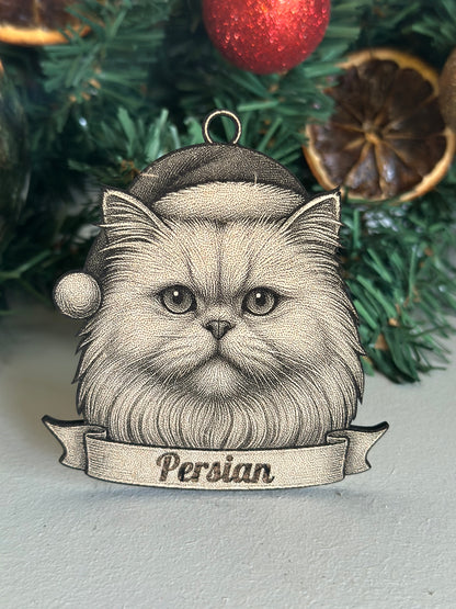 Decorative ornament of a Persian cat with a banner on a Christmas tree.