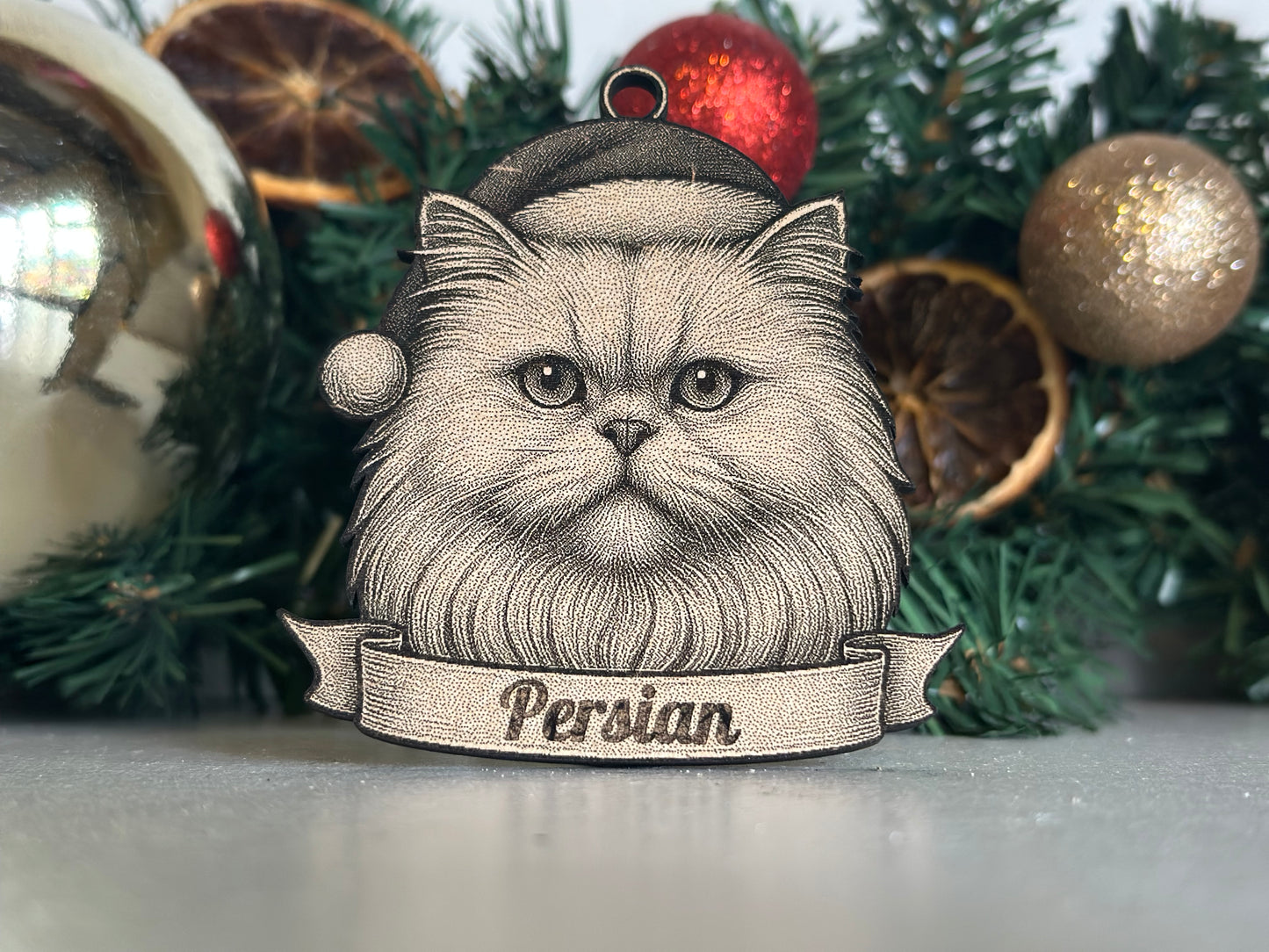 Illustration of a Persian cat's face with a banner on a Christmas tree background