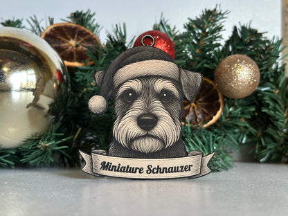 Decorative ornament with a miniature schnauzer dog illustration on a Christmas tree.