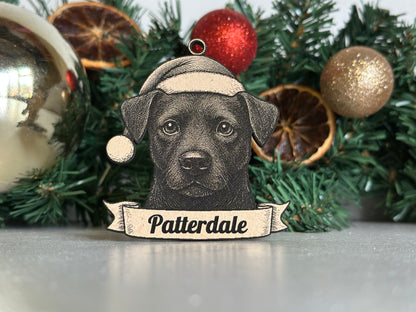 Decorative ornament with a dog illustration and 'Patterdale' text on a Christmas wreath.