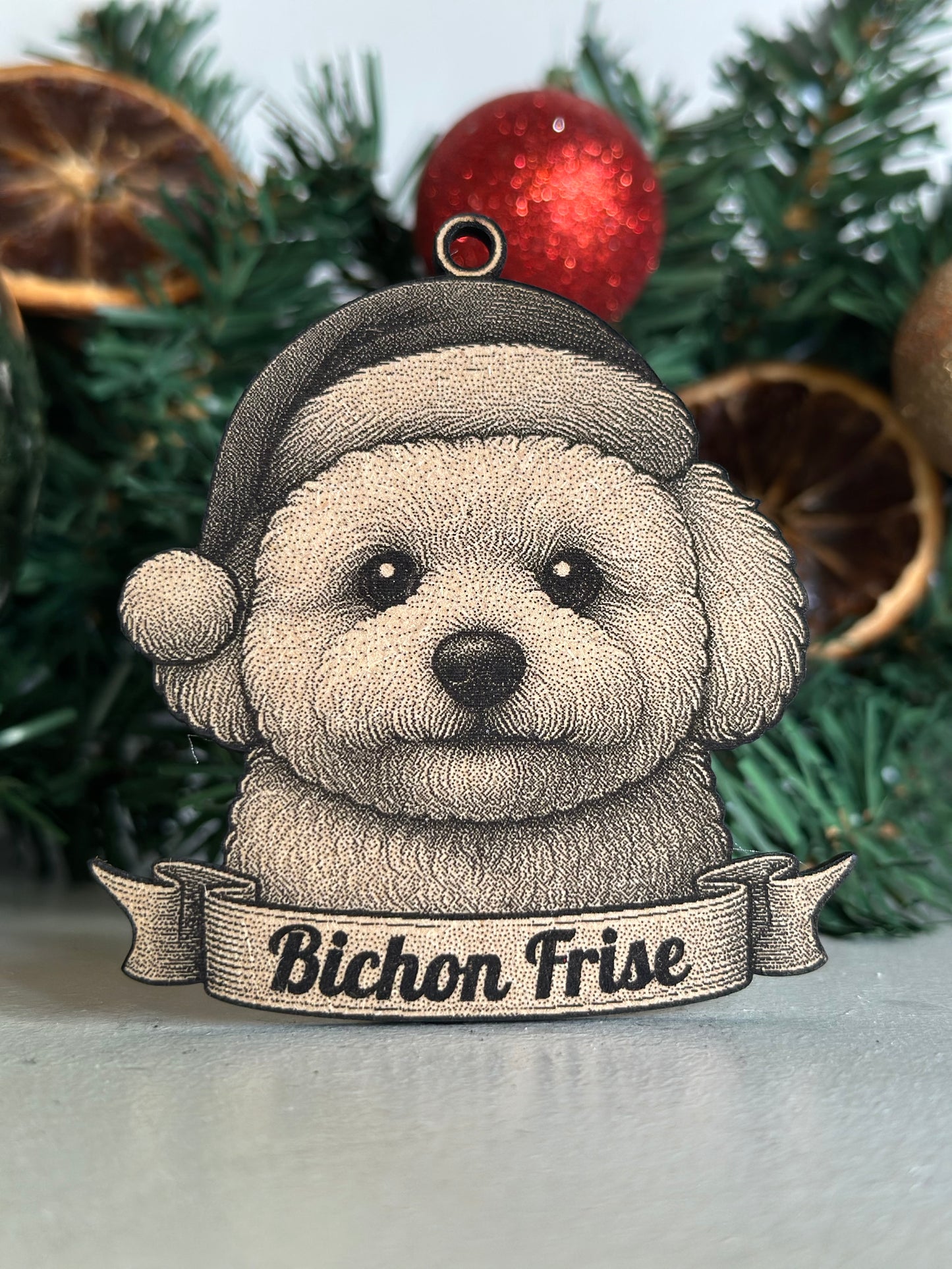 Decorative ornament of a Bichon Frise dog on a Christmas tree with ornaments.