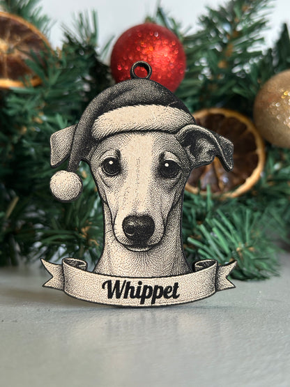 Decorative ornament of a whippet dog on a Christmas tree with ornaments.