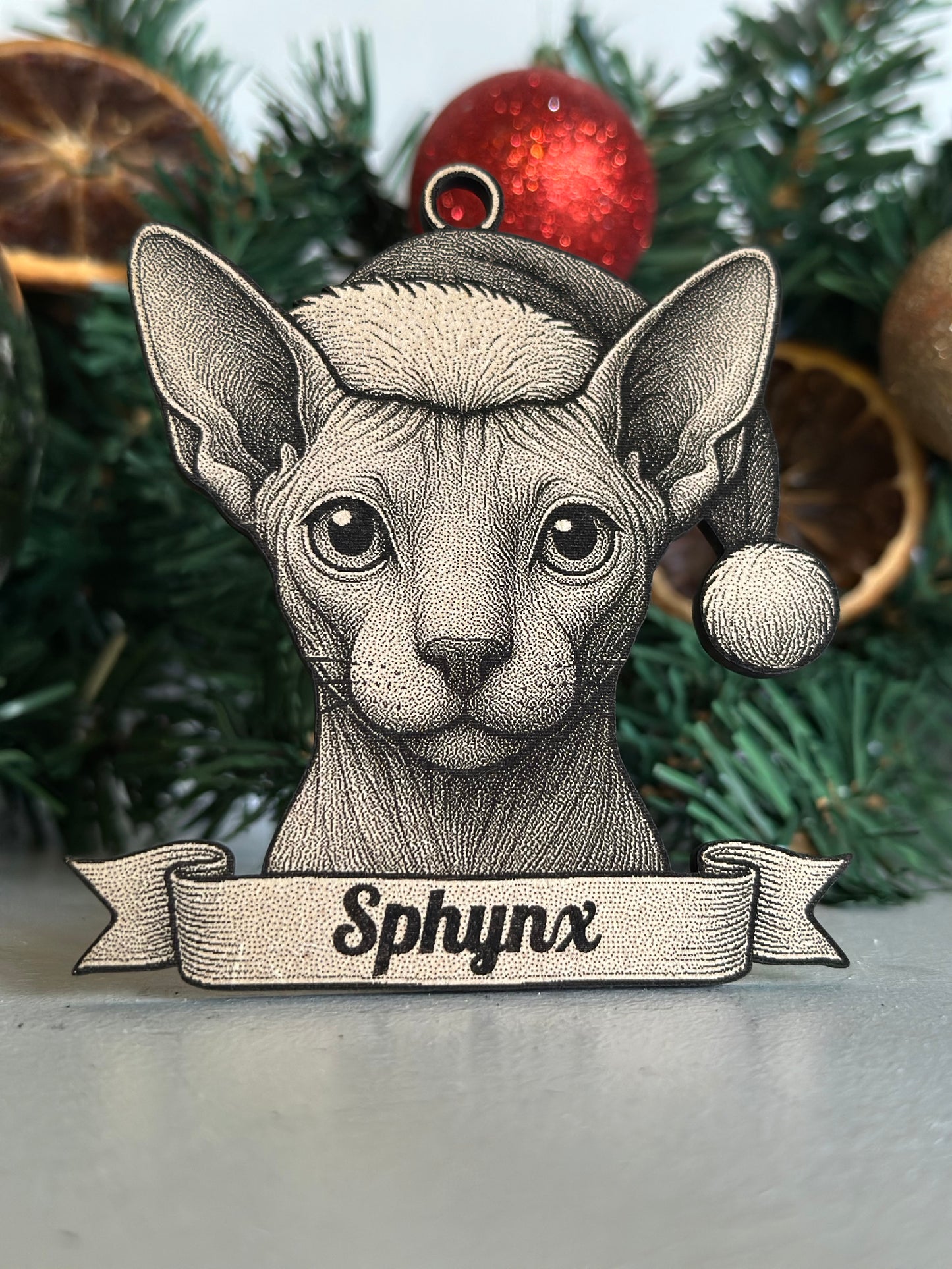 Illustration of a Sphynx cat on a Christmas tree with ornaments.