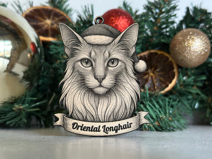 Decorative Christmas ornament with a stylized face and 'Oriental Longhair' text on a green leafy background.