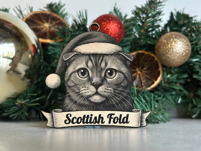 Decorative Christmas ornament with a cat illustration and 'Scottish Fold' text on a wreath background.