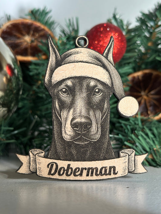 Decorative Christmas ornament of a doberman with a Santa hat on a Christmas tree.