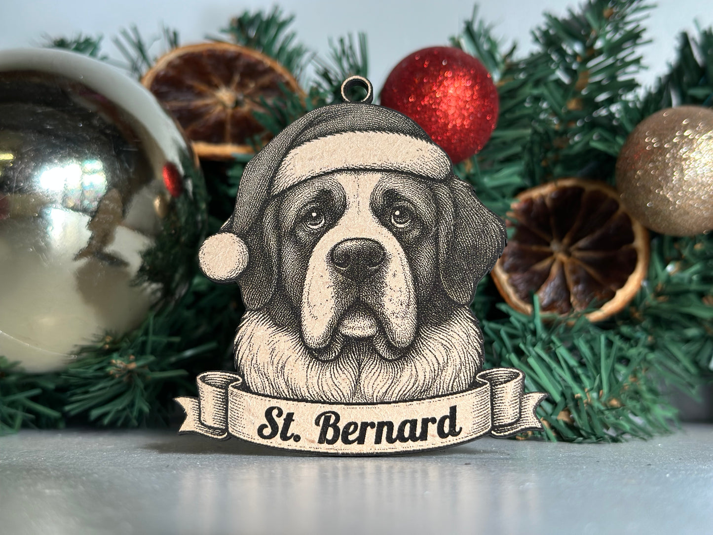 Decorative St. Bernard ornament on a Christmas tree with ornaments and spices.