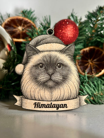 Decorative ornament with a Himalayan cat design against a Christmas-themed background.