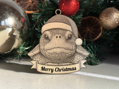 Decorative turtle ornament with a Santa hat and 'Merry Christmas' banner, surrounded by Christmas decorations.