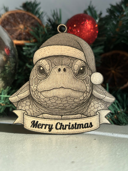 Decorative turtle ornament with 'Merry Christmas' banner on a Christmas tree.