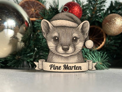 Decorative ornament of a Pine Marten with a banner on a Christmas tree.