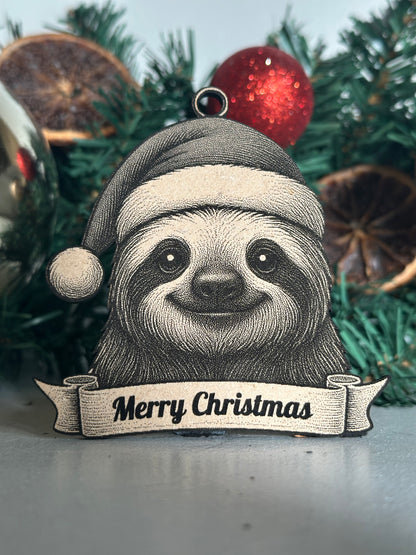 Sloth ornament with 'Merry Christmas' banner on a decorated tree