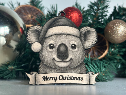 Illustration of a koala wearing a Santa hat with 'Merry Christmas' banner on a Christmas tree background.