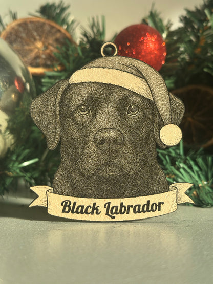 Black Labrador ornament on a Christmas tree with a label