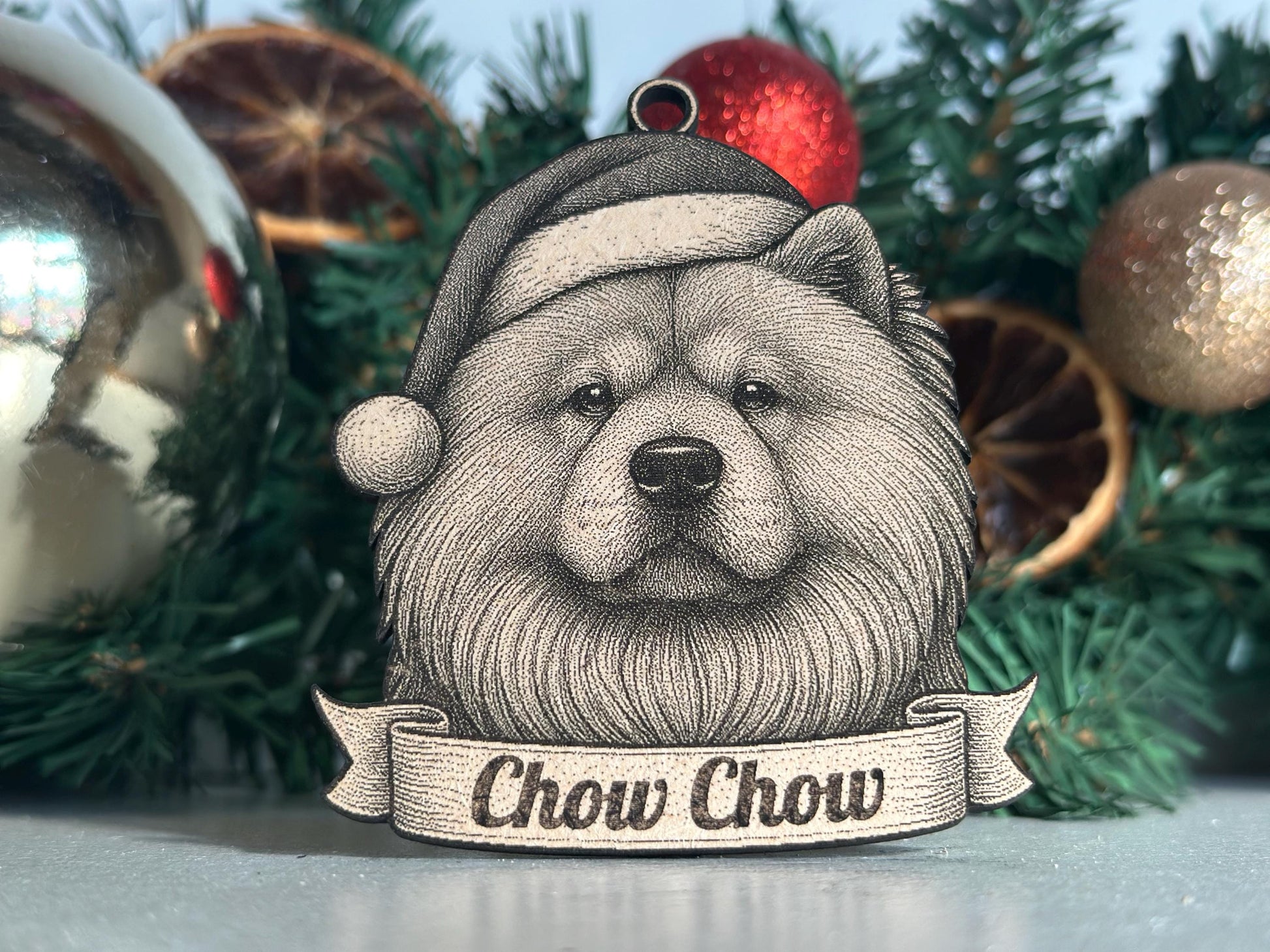 Decorative ornament with a Chow Chow dog illustration wearing a Santa hat against a Christmas tree background.